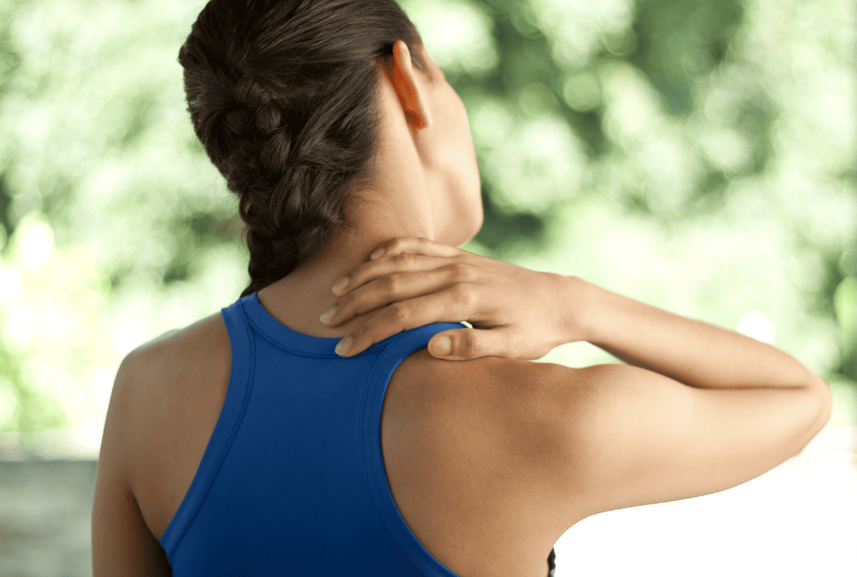 woman holding back of neck in discomfort