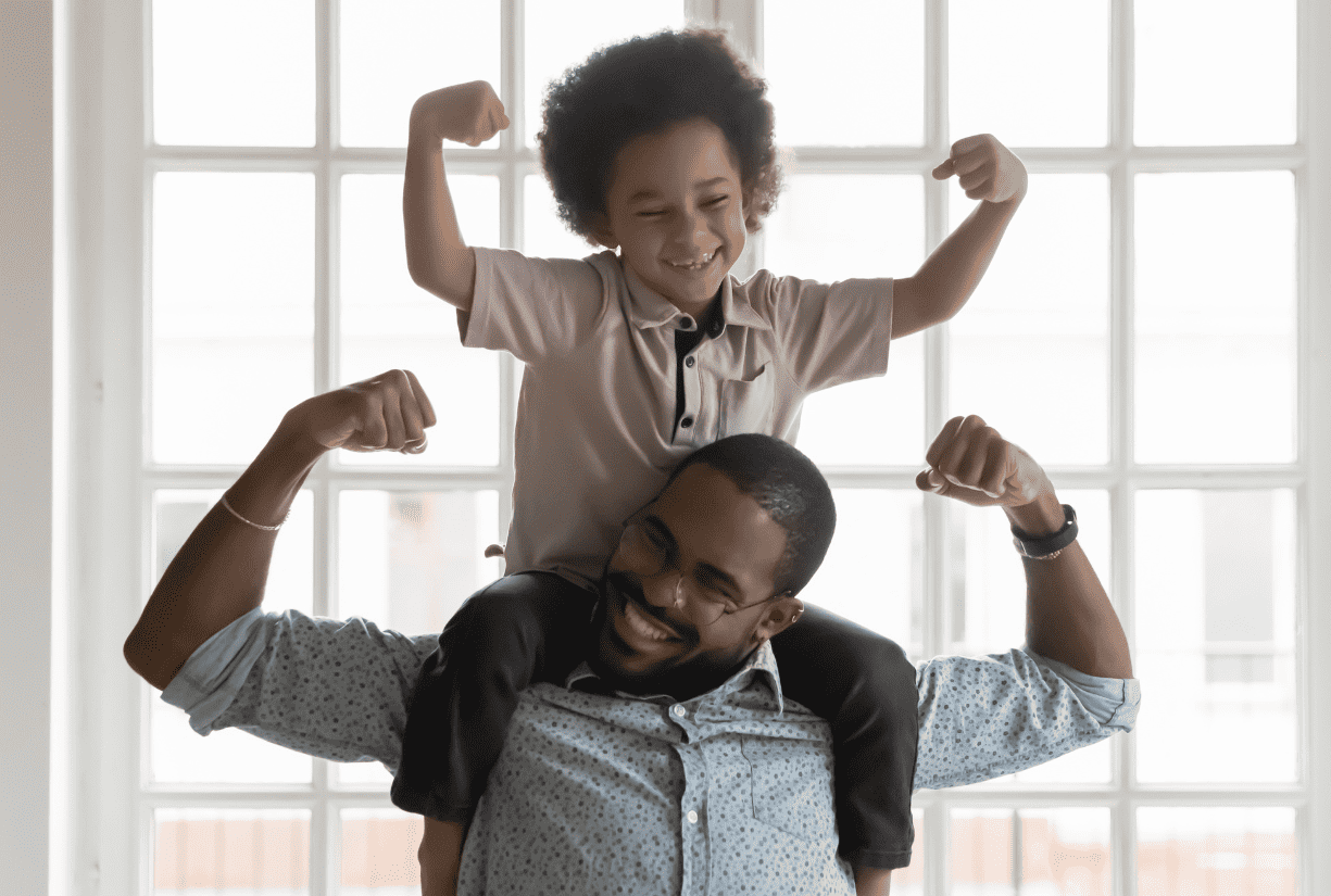 man giving piggyback ride to his son