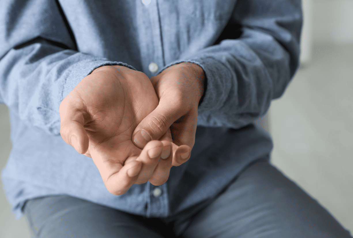 man holding and examining palm